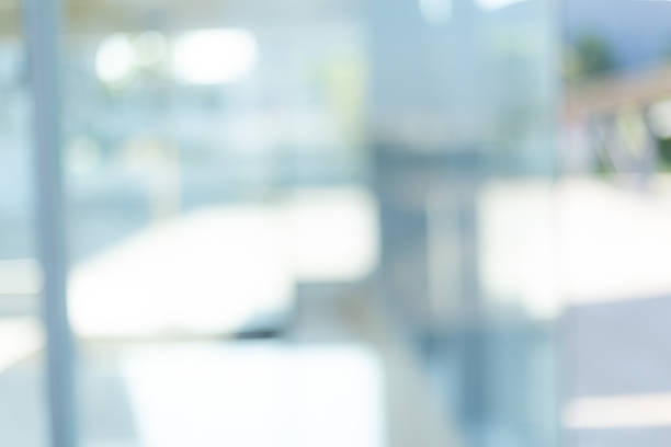 istock White blur background,Blurred abstract grey glass wall from building background. 2211775527