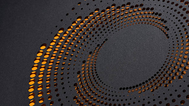 istock Abstract circular pattern cut into black paper revealing glowing orange layers in concentric spiral design layout 2211777658