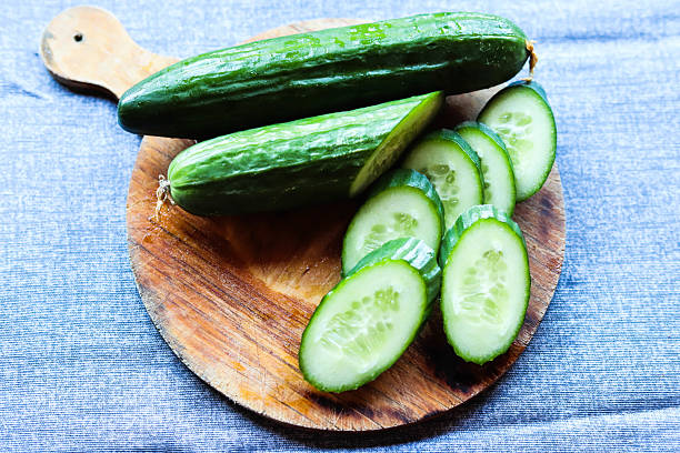 istock Green cucumber with water drops 2211779526