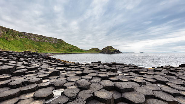 istock Northern Ireland Giants Causeway Hexagonal Rock Formation Panorama 2211780031