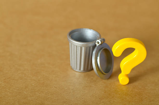 Minimalist Concept of Waste and Value  Empty Garbage Bin with Question Mark Suggests Uncertainty