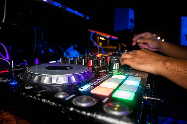 istock Dj playing a mixing machine during a party. 2211787805