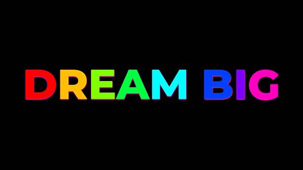 istock Large Text DREAM BIG with randomly colored letters with colors of the rainbow on black 2211789506