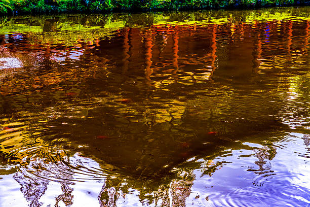 Colorful Water Reflection Abstract Patterns Byodo-In Buddhist Temple Memorial Park Kaneohe North Shore Oahu Hawaii. Replica of temple in Kyoto, Japan. Dedicated in 1968 to commemorate the first Japanese immigrants to Hawaii.