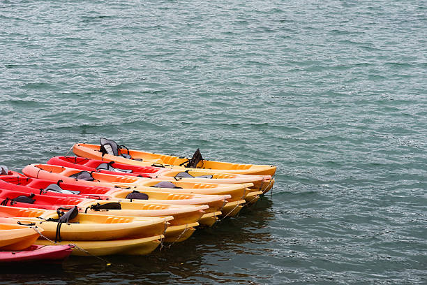 istock a vibrant array of red and yellow kayaks 2211792411