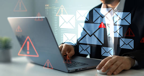 istock Email security and virus spam alert in email. Fake text email scam.Scammers online.Cyber scam. Spam email message on digital screen. 2211794981