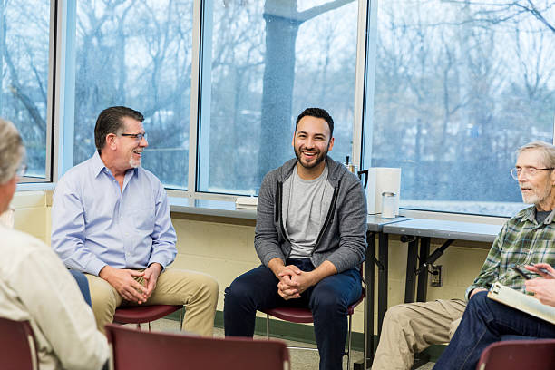 istock Group Therapy Session: Diverse Adults Discussing Mental Health 2211795822