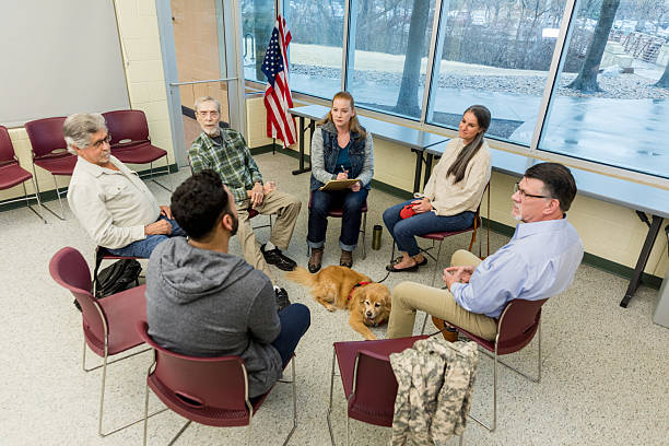 istock Group therapy session with a therapy dog, support group meeting 2211795825