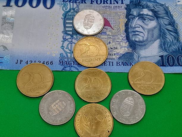 istock Hungarian forint with arrow and green background. 2211796262