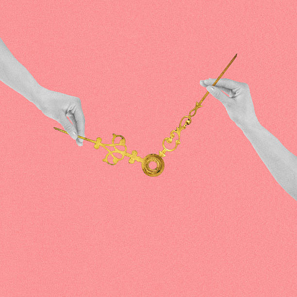 istock Woman hands adjusting golden clock arrow hands 2211797692
