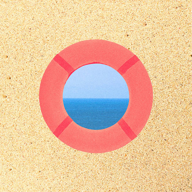 Abstract collage illustration of red and round lifebuoy in beige sand background. Visible see or ocean through lifebuoy. Grunge, noise and motion blur effect applied, retro vintage style