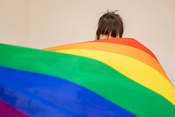 istock Girl with Rainbow Flag 2211801003