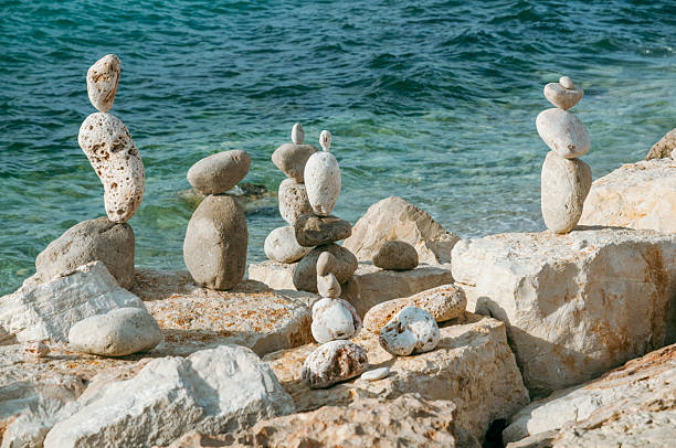 istock Balancing stones creating harmony on the rocky coastline 2211807101