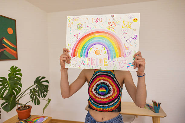 istock Artist Holding a Rainbow-Themed Poster 2211811964