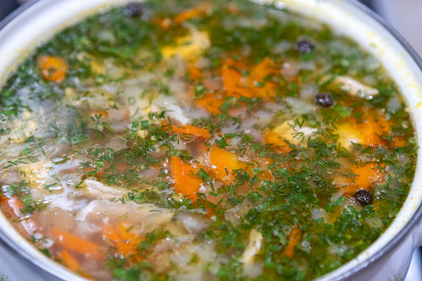 istock Fresh vegetable soup is cooked in a saucepan 2211812408