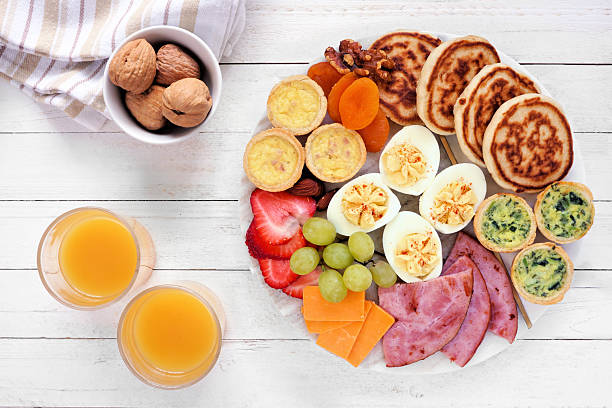 istock Breakfast or brunch grazing board. Top view table scene on a white wood background. 2211818567