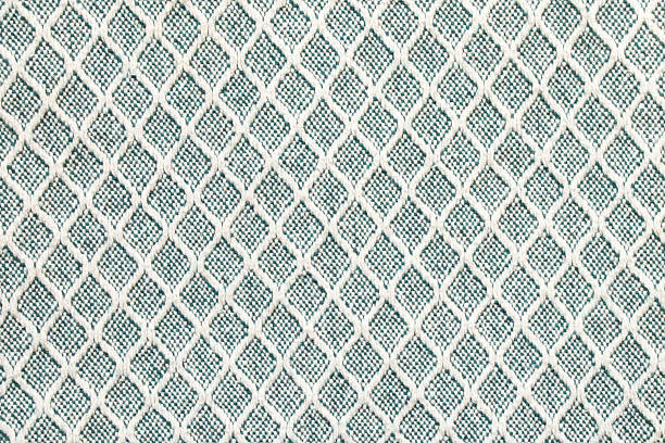 istock Close-up of a diamond pattern blanket, fabric texture 2211823585