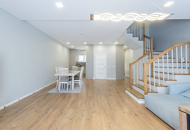 istock Modern Minimalist Dining Area and Staircase Interior with Stylish Lighting 2211826118