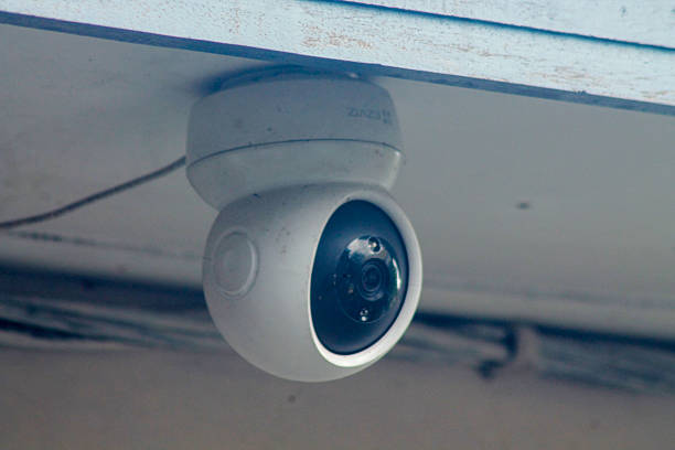 istock CCTV surveillance security camera video equipment on pole outdoor building safety system area control 2211826868