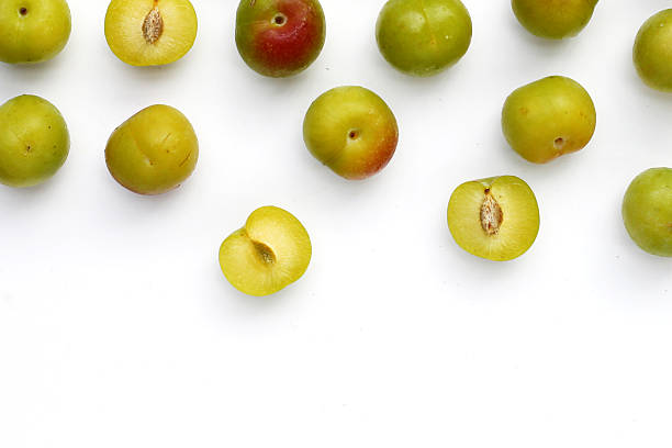 istock Fresh green plum fruit on white background. 2211833414