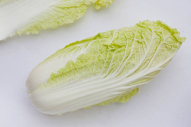 istock Chinese cabbage on yellow background. 2211834973