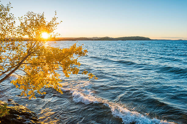 Sunset at Lake Superior, Presque Isle Park in Marquette, Michigan, USA during autumn.