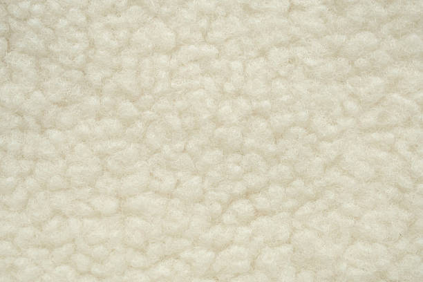 istock Wool plush fleece fur fabric texture background 2211843101