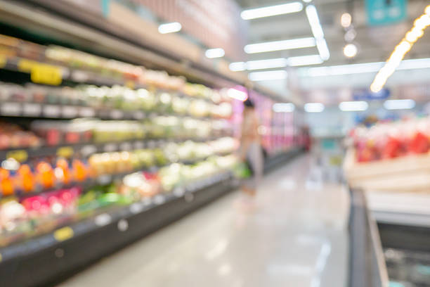 istock Grocery store aisle and shelves interior blurred background 2211843481