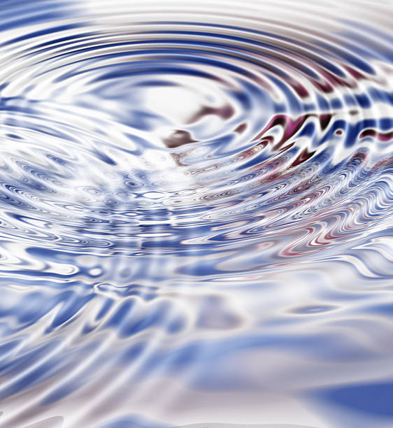 istock Abstract ripples on shimmering water with colorful reflections 2211844276