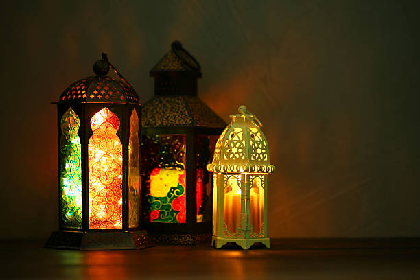 istock Decorative Arabic lanterns on table against dark background 2211845131