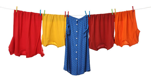 istock Different clothes drying on laundry line against white background 2211845136