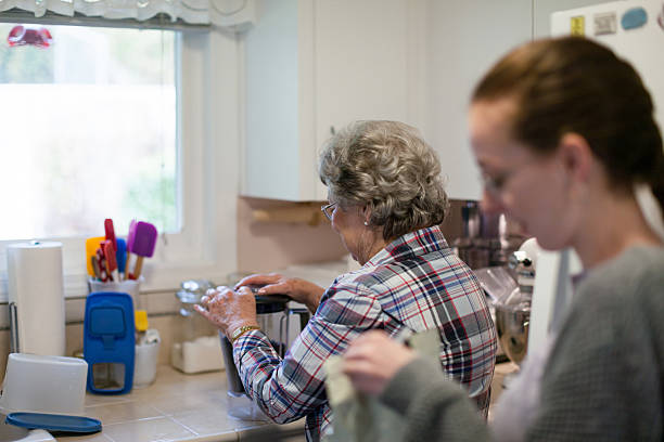 istock Senior Adults Making Coffee in home kitchen 2211845315