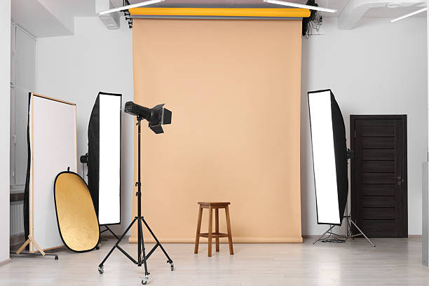 istock Beige photo background, stool and professional lighting equipment in studio 2211845363