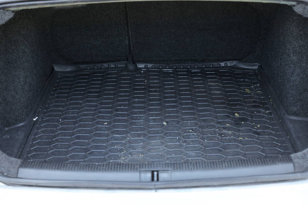 istock Black rubber car boot liner mat in trunk of auto 2211845732