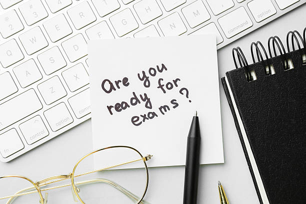 istock Paper note with question Are You Ready For Exams and stationery on grey background, flat lay 2211845733