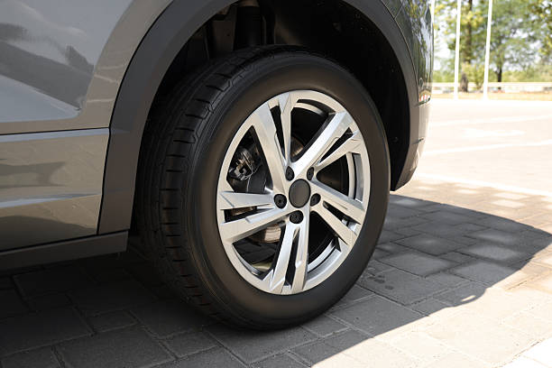 istock Modern car with big wheel outdoors, closeup 2211845741