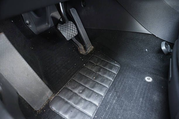 istock Black soft car floor mat in auto 2211845805
