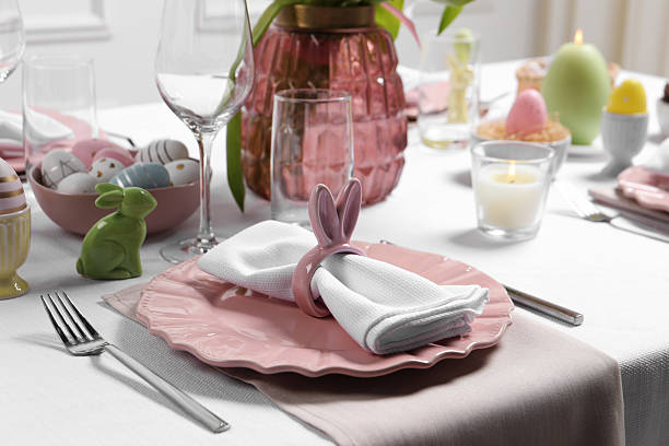 istock Festive table setting with napkin ring in shape of bunny ears. Easter celebration 2211845936