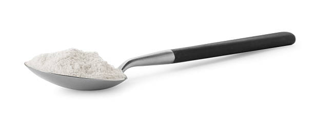 istock Baking powder in spoon isolated on white 2211845950