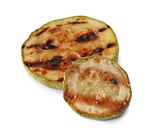 istock Two tasty grilled zucchini slices isolated on white 2211846010