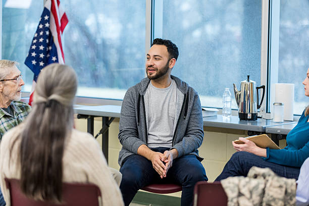 istock Group Therapy Session: Diverse Adults Discussing Mental Health 2211854227