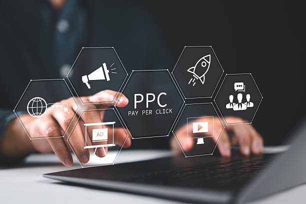istock Pay per click PPC concept. Advertising in Search Engine Platforms. Digital Marketing Strategies and Goals. Businessman using laptop with PPC icon on virtual screen. 2211854352