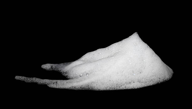 istock white foam soap isolated on a black background 2211858670