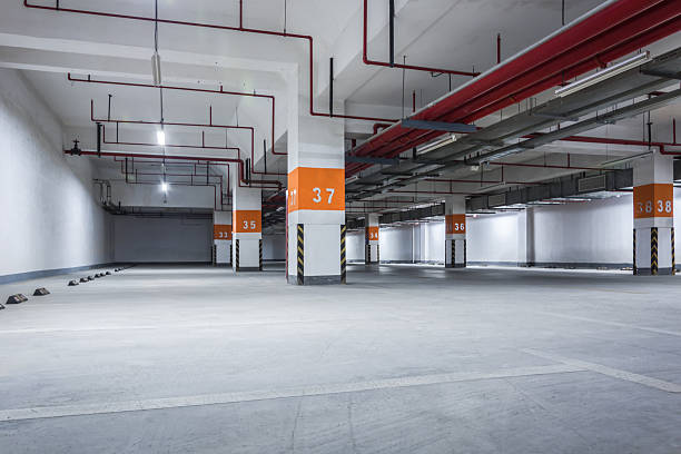 istock Spacious and Modern Underground Parking Garage with Clear Numbering and Illumination 2211861360