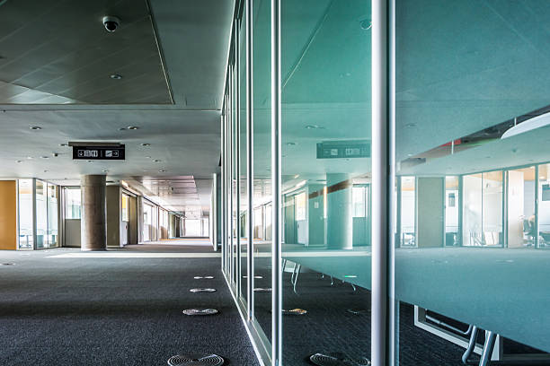 istock Sleek Modern Office Interior with Reflective Glass and Open Spaces 2211861362