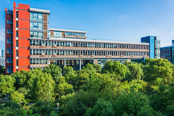 istock Modern Architectural Marvel Surrounded by Lush Greenery and Blue Skies 2211861423