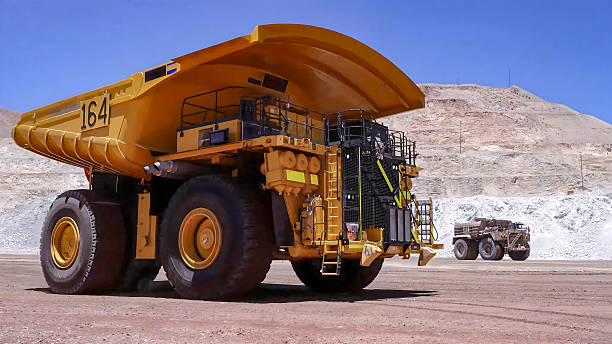 istock Giant mining truck transporting minerals in an open pit mine 2211866685