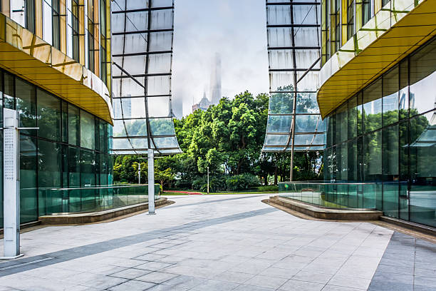 istock Contemporary Urban Architecture Framed by Lush Greenery in a Dynamic Cityscape 2211867866