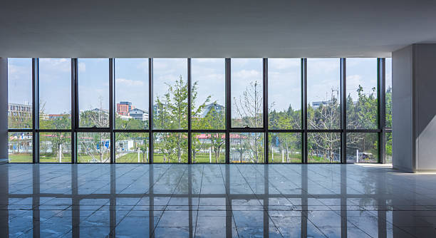 istock Bright and Modern Interior Space Featuring Expansive Windows and Scenic Views 2211869176