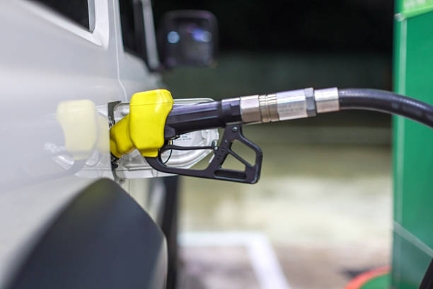 istock Pumping gasoline fuel in car 2211871550